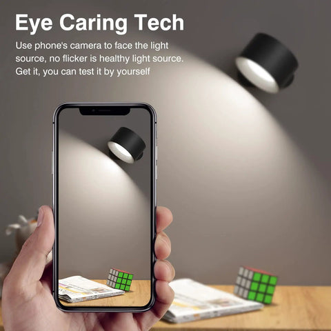 Image showing Cordless Battery Powered LED Wall Sconce With Rechargeable Battery No Wires in a bedroom, seen through a phone screen.