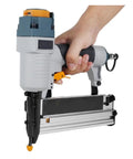 Close-up of Oil Free Pneumatic Staple Gun And Air Nailer With Slick Depth Adjustment Non Slip Handle, held by hand, showcasing driver set.