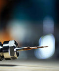 Close-up of SpeTool tapered ball-nose end mill in a CNC router collet with 1/4" shank.