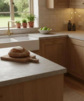 Heavy Duty Water Based Concrete Countertop Sealer With Slick Matte Finish And Food Safe Shield In A Tough Four Pack Kit For Quick Apply and Long Lasting Acrylic Guard on a kitchen island with bread and green apples.