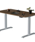 Stylish Grey Dual Motor Electric Standing Desk Frame With Built In Usb A Plus C Charging Ports Smooth Height Adjustable Sit Stand Base Sturdy Steel Legs For Home Office Workstation Setup Super Easy To Assemble with a wooden top and office supplies.