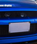 Close-up of a blue car with 4 Pack Aluminum Alloy License Plate Bolts Anti Theft M6 Screws For Cars Trucks And Motorcycles Black Fasteners