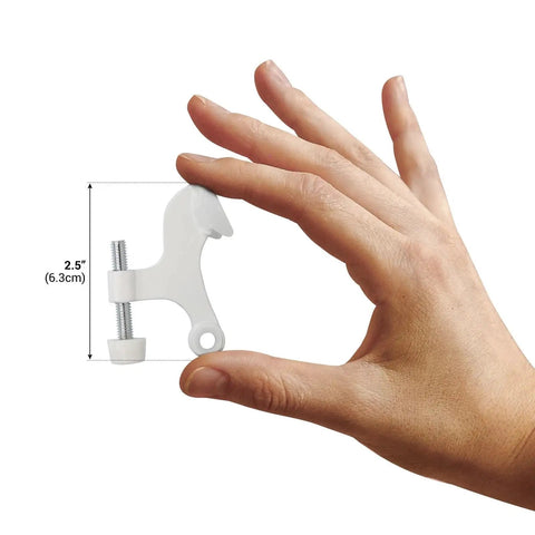 Person holding one of the Five Pack Heavy Duty Hinge Pin Door Stop in White for Slam Proof Door Control, measuring 2.5 inches