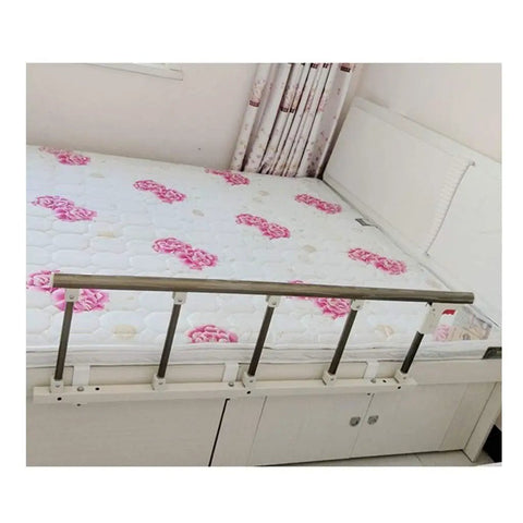 Foldable Bed Side Guard Rail For Toddlers And Seniors next to flower-patterned mattress, easy install hospital-grade metal railing