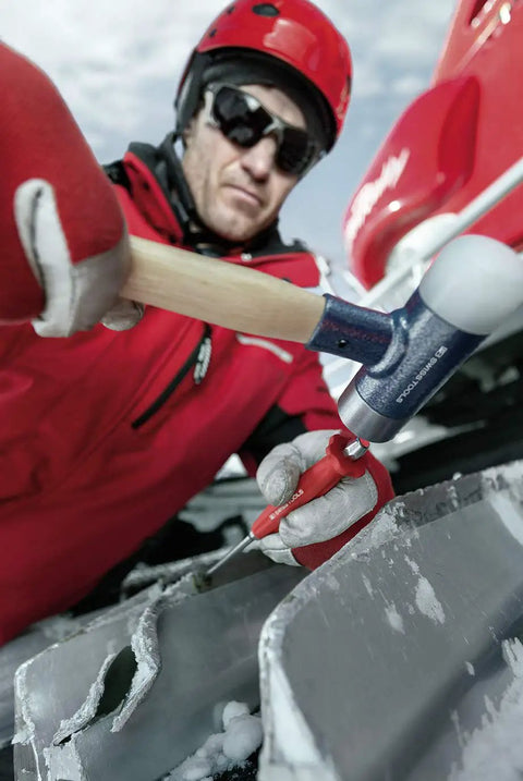 Person using Drift Punch Set Six Piece 2 To 8 Millimeter Pin Punches In Octagon Steel With Non Slip Grips Comes In Tool Box All Swiss Made Quality