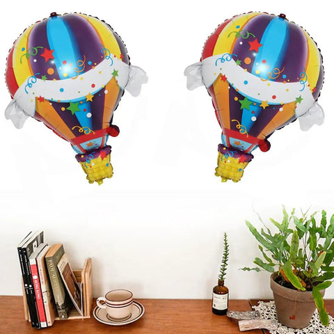 Two Pack Hot Air Balloons Foil Balloons For World Travel Themed Party Baby Shower Birthday Bash Wedding Decor Double Sided Mylar Balloons Self Sealing Float With Helium Or Air over a shelf with books and plant