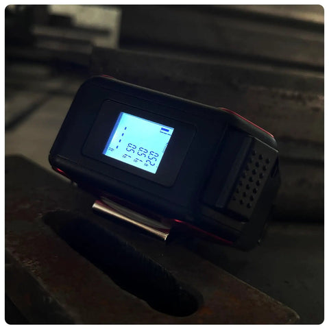 Two In One Laser Tape Measure With Level And Backlit LCD 131 Ft Laser Distance Meter 16 Ft Auto Lock Tape Ft In Fractions Mm Red on metal surface