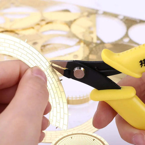 Two Pack Mini Flat Nose Pliers Nippers DIY Tool Set for 3D metal model kits, yellow handle cutting intricate metal piece.