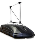 Heavy Duty Garage Ceiling Hoist For Cargo Box Pulley System Holds 150 Lbs With Pulley Lift For Rooftop Carriers And Smart Garage Storage And Organization For 8 To 10 Foot Ceilings installed holding a black rooftop carrier