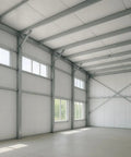 Interior view of a spacious building with steel beams and windows, suitable for installing Heavy Duty 10mm Foam Core Radiant Barrier Roll, 60 By 100 Feet Reflective Insulation Sheet, R20 Thermal Heat Shield Blocks Summer Swelter And Winter Drafts, Straight Up Crushes Energy Bills.