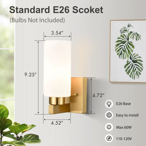 Gold Wall Sconce Set Of 2 Dimmable Vanity Lights With Milky White Cylinder Glass Shades, Modern Metal Finish next to a plant