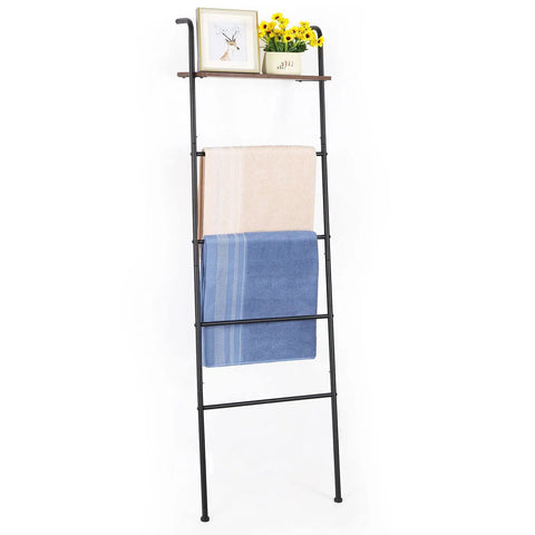Versatile Blanket And Towel Ladder With Shelf Wall Leaning Black Iron Rack displaying towels and decor items.