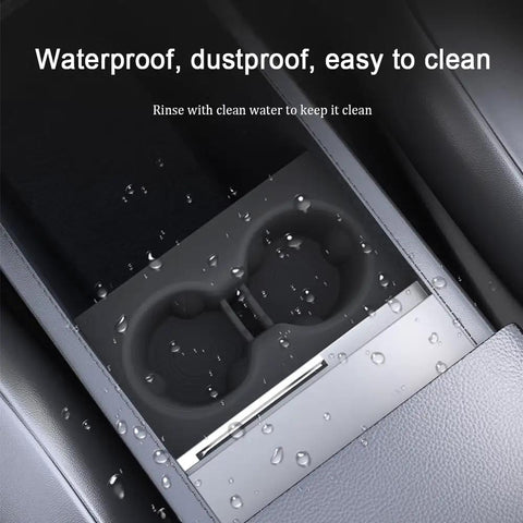 Slick White Silicone Cup Holder Tray For Tesla Model Y 2025 Center Console showing waterproof design with water droplets.