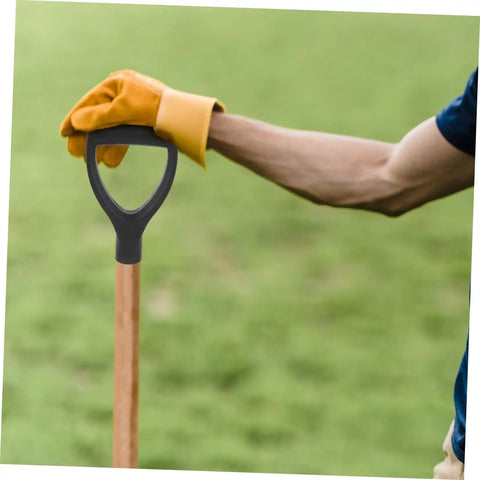 Person holding a shovel with Shovel Handle Replacement Spade Handle for Gardening Tools with Easy Grip handle in a garden