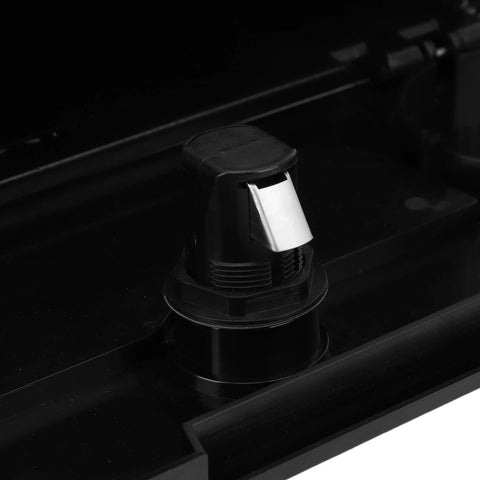 Close-up of black plastic marine glove box lock on boat console with silver latch.