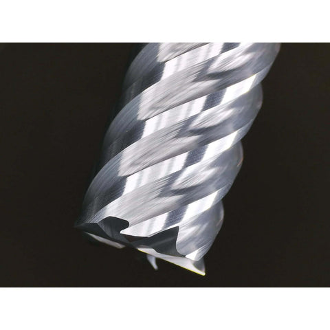 Close-up of carbide end mill with 6 flutes, silver metal, 1/4" shank.