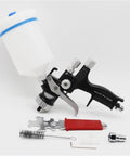 Professional 1.3mm Airbrush Spray Gun Kit With Adjustable Air Regulator And Inline Moisture Filter showing spray gun with tools and bottle.