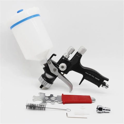 Professional 1.3mm Airbrush Spray Gun Kit With Adjustable Air Regulator And Inline Moisture Filter showing spray gun with tools and bottle.