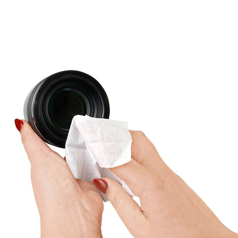 Hand cleaning camera lens with Pre Moistened Lens Wipes Individually Wrapped For Grab And Go Cleaning Of Glasses Phones Camera Lenses Screens