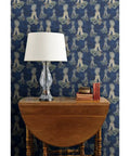 Little Rococo PVC Free Wallpaper Featuring Heavy Duty Poly Blend With Smooth Linen Texture For Kitchens Bathrooms And Mudrooms with table lamp and books.