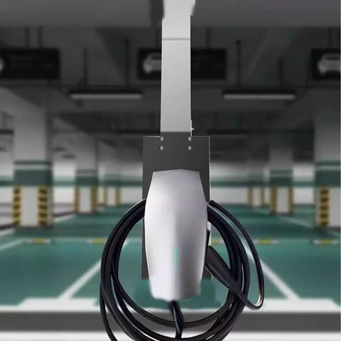 Tough As Nails Stainless Steel EV Charger Cover And Weatherproof Station Box with a charging cord in an indoor parking lot.