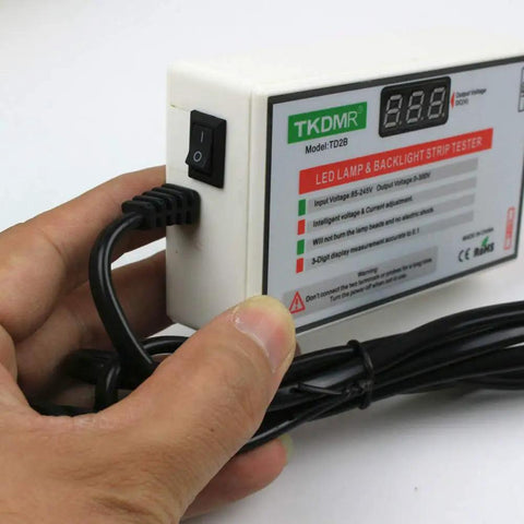 Hand holding LED TV Backlight Tester Tool For All LED Light Repairs, Safely Troubleshoots Backlight Problems, 0-300V Output
