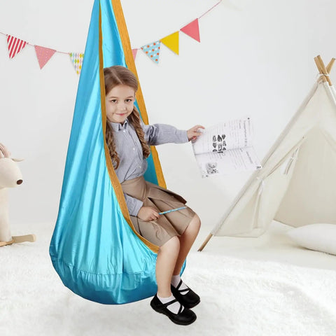 Child sitting in Ultra Comfy Kids Swing Seat Hammock Chair For Indoor Or Outdoor Use with soft nylon material and reinforced stitching.