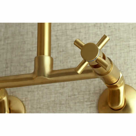 Close-up of Concord 8 Inch Adjustable Center Wall Mount Kitchen Faucet in brushed brass showing cross handle design