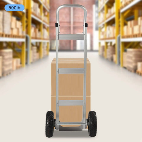 Rugged Aluminum Folding Hand Truck And Rolling Dolly Cart With 500 Pound Capacity and 10 inch pneumatic tires with a box.