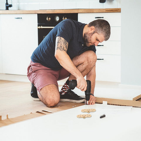 Man installing Brass Folding Table Hinge With Round Edges Heavy Duty Desk Hinge for computer desks and furniture accessories