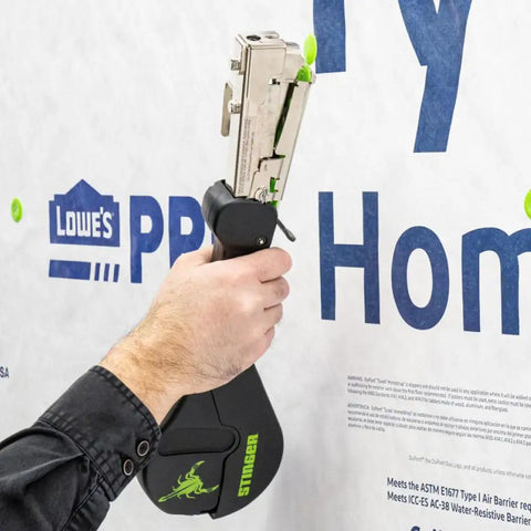 Top Shelf 3 8 Inch Plastic Cap Staples For Housewrap Roofing And Insulation Installations Featuring Bombproof Retention And Premium Weather Proofing Build 2016 Pack in use with a stapler on housewrap.