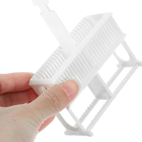 Pro Grade 24-Slot Plastic Microscope Slide Staining Rack Compact 4.33 by 3.38 by 1.25 Inch Lab Storage Organizer For Research And Experiments Keeps Slides Neat Easy Access Durable Space Saving, white 24-slot rack held in hand