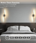 Modern Hardwired LED Wall Sconce Set Of Two With Remote Control in a bedroom, highlighting 5 modes timer function.