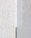 Self-Adhesive Stress Crack Tape 1.25 Inch By 12 Foot Textured Roll applied on corner wall plaster crack repair