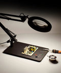 12x Magnifying Glass With Light And Stand for Repair and Soldering Hands Free Dual Function LED Magnifier over electronics on desk