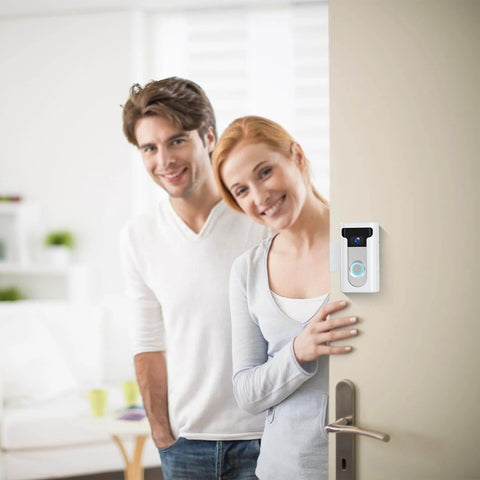 Two people beside a door with No Drill Video Doorbell Mount For Ring And Blink White Wedge Bracket Adapter installed above handle.