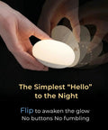 Hand demonstrating Baby Night Light For Nursery And Nighttime Feeds, Soft BPA Free Silicone, Eye Caring Glow, Flip On Flip Off Design