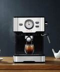 Household Semi Automatic Espresso Machine With Twenty Bar Pressure brewing espresso shot into glass cup on wooden counter.