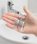 Top Tier 12 Pack 7 ml Mini Glass Bottle Keychains Featuring Secure Screw Lids And Heavy Duty Metal Rings ready to roll in hand.