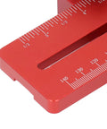 Close-up of a red aluminum Table Saw Thin Jig with Roller Design, featuring measurement markings and adjustable length.