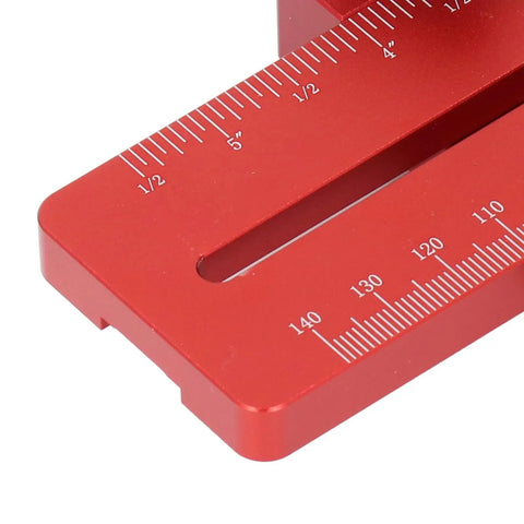 Close-up of a red aluminum Table Saw Thin Jig with Roller Design, featuring measurement markings and adjustable length.