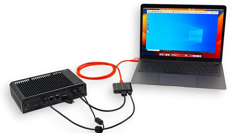 Slick Portable Kvm Console Adapter connected to laptop via HDMI and USB for headless server management.