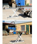 Heavy Duty Electric Lifting Elevator Mobile Lift Truck Folding Flatbed Cart For Warehouse Freight Handcart Easy Storage In Trunk at a job site.