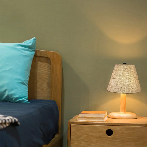 Bedroom setup with Black Linen Cone Barrel Lamp Shade Set Of 2 For Floor And Table Lamps, 7x14x9 Inches, on wooden table lamp.