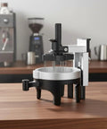 Premium Espresso Coffee Distributor And Tamper Leveler With Adjustable Rotary Depth And Twelve Prongs on wooden counter.