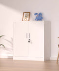 White lockable storage cabinet with doors, featuring a metal lock and handles, placed in a living room with decor on top