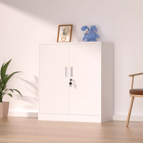 White lockable storage cabinet with doors, featuring a metal lock and handles, placed in a living room with decor on top