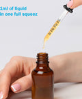 1 ml glass pipette dropper with clear scales dispensing liquid into amber bottle, part of 8 Pack Glass Pipette Droppers With Bent And Straight Tips, 1 Ml Measuring Eyedroppers For Essential Oils, Crafts, Lab Work, Ear And Eye Care, Liquid Transfer Tool With Clear Scales For Quick And Precise Drops.