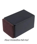 Rock Solid Carbon Steel Furniture Lifters That Dial In Your Level Game Perfect For Any Couch Or Table Pack Of Four Straight Line Black Square Pads With Soft Felt Liners close-up of a felt pad with black edges.