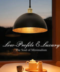 Boss Black And Gold Leaf Pendant Light With Handcrafted Metal Shade Vintage Ceiling Fixture over dining table at dusk.
